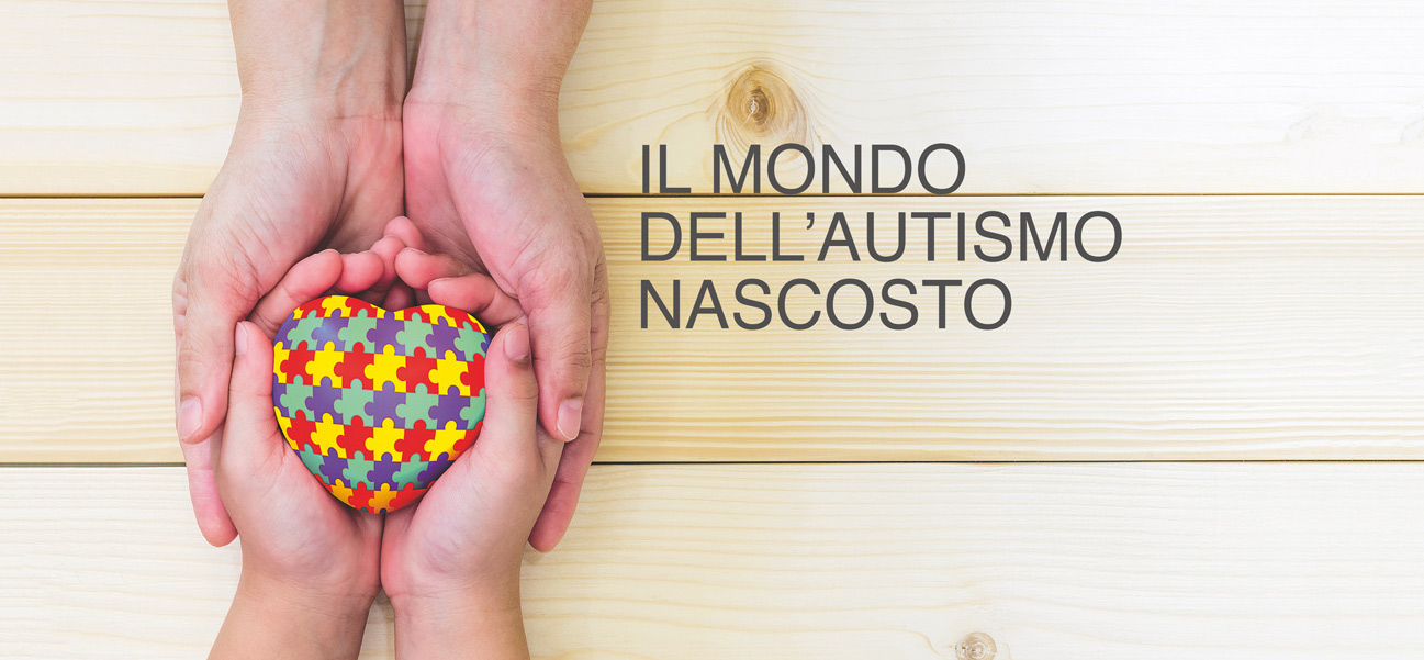 World Autism Awareness day concept with puzzle or jigsaw pattern on heart with autistic child's hands supported by nursing family caregiver